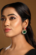 Danglers in gold tone brass with Zircon Diamond, Kundan Polki, Enamel, Synthetic Emerald, Have Been Used