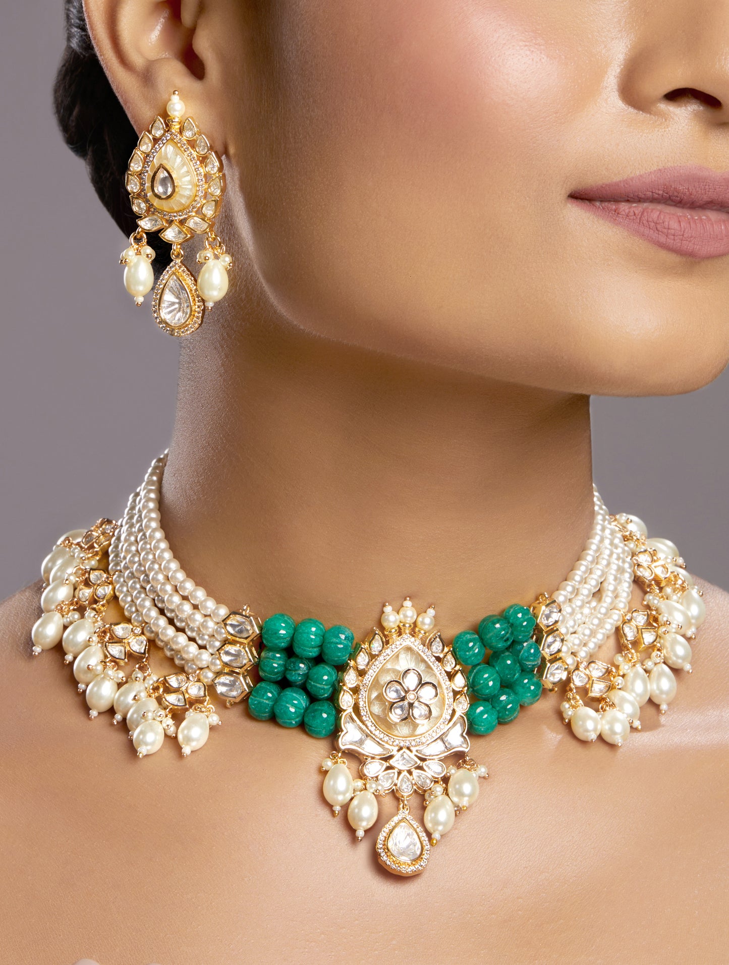 Choker in gold with Micron Gold Polished Brass ,mosanite kundan polki and pale yellow carved onyx stone, and green onyx tumbles. shell pearls and zirconia