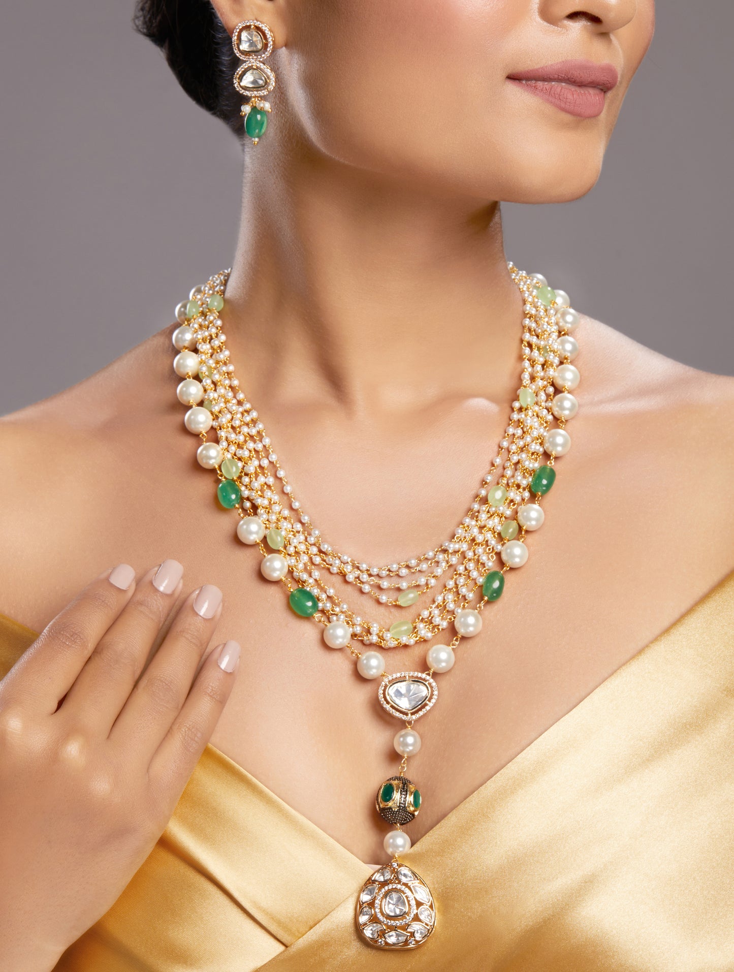 Layered Necklace in gold with MicronGold Polished Brass ,mosanite kundan polki, zirconia, NAtural Agates tumbles, Shell Pearls, Synthetic emerald etched in gold and oxidised polish oval ball